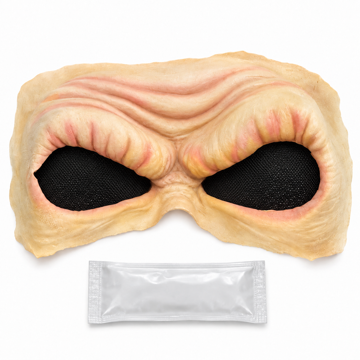 Prothèse Evil Eyes couleur chair avec deux orbites recouvertes d’un filet noir et sachet d’adhésif