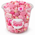 Pot transparent Sweet Land rempli de bonbons roses assortis avec fleurs, animaux, boules, cônes et briques de guimauve