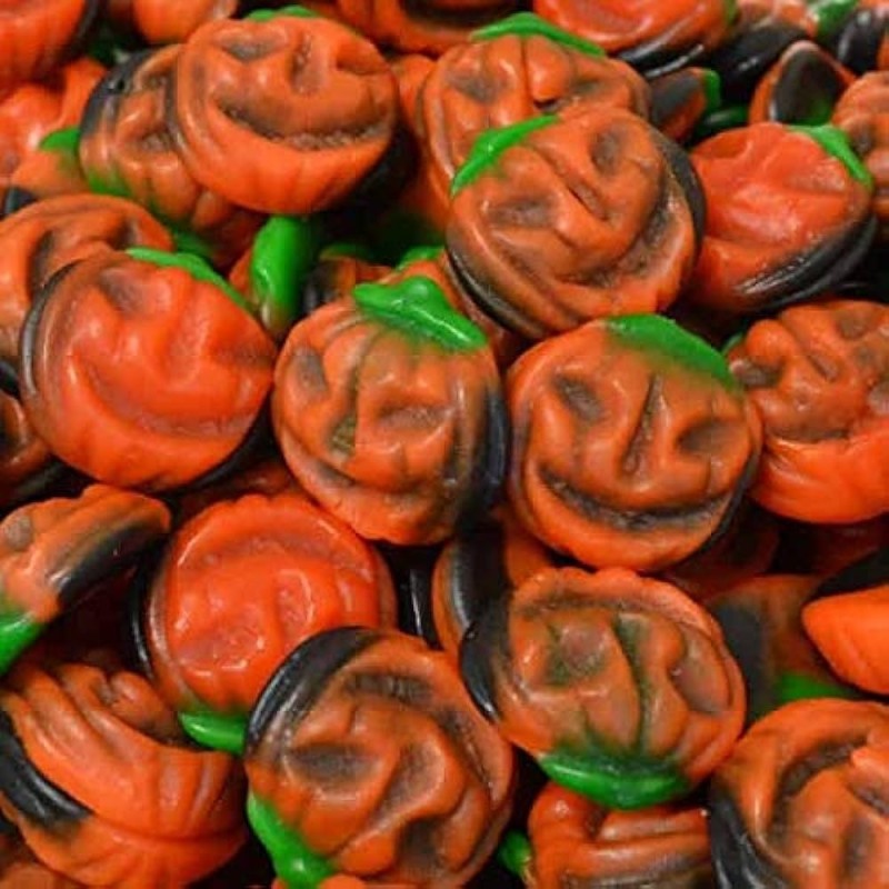 Bonbons Vidal en forme de citrouilles orange avec détails verts et visages noirs pour Halloween
